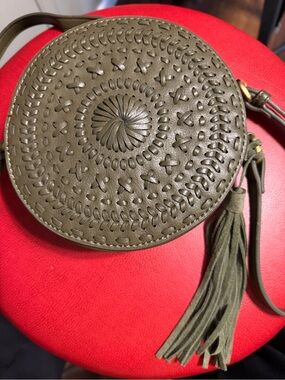 Anthropologie Olive Green Round Woven Crossbody Bag with Tassel.